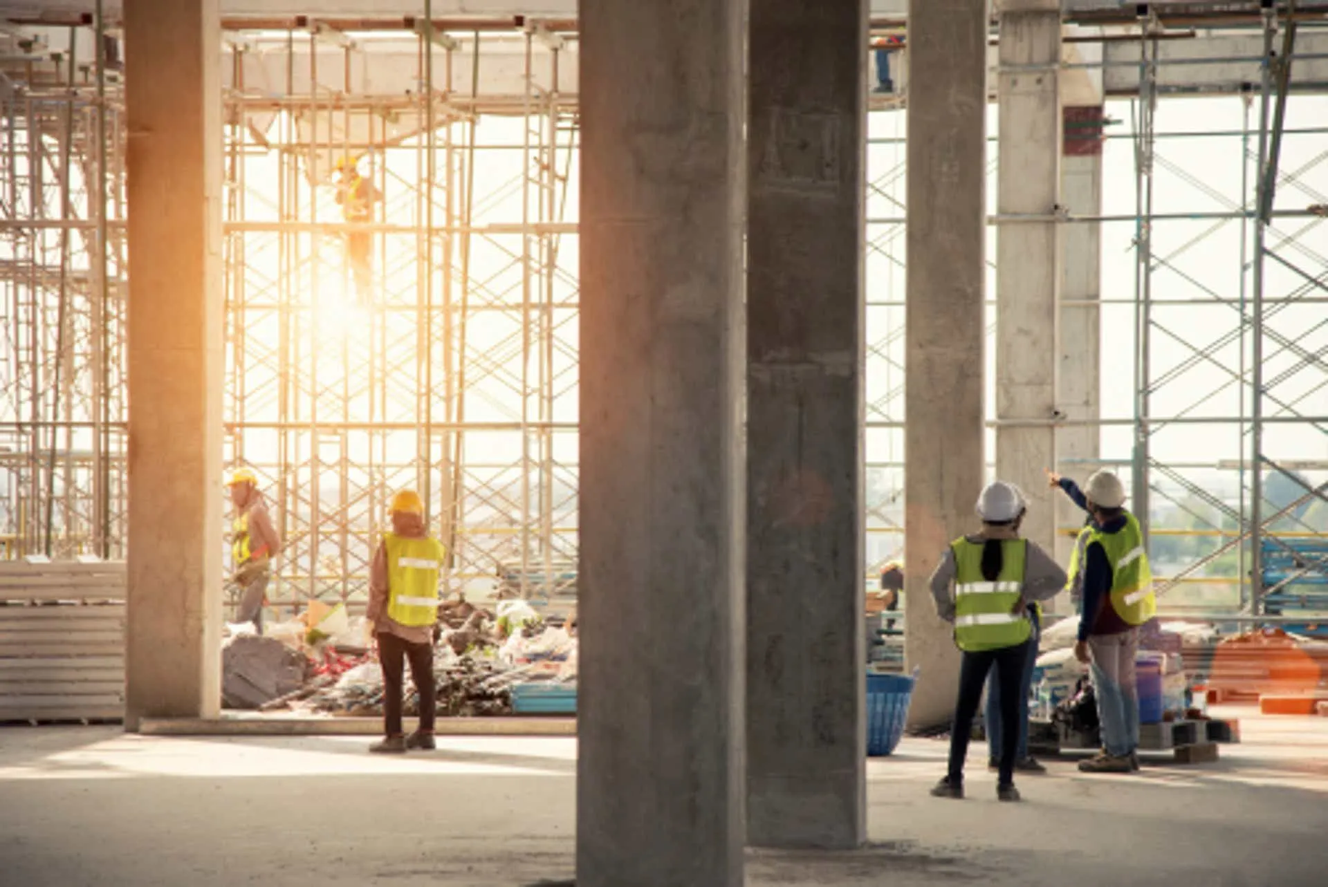 Interior of a large commercial building under construction with concrete columns