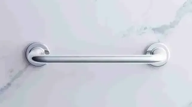 Stainless steel grab bar mounted on a marble bathroom wall for safer access